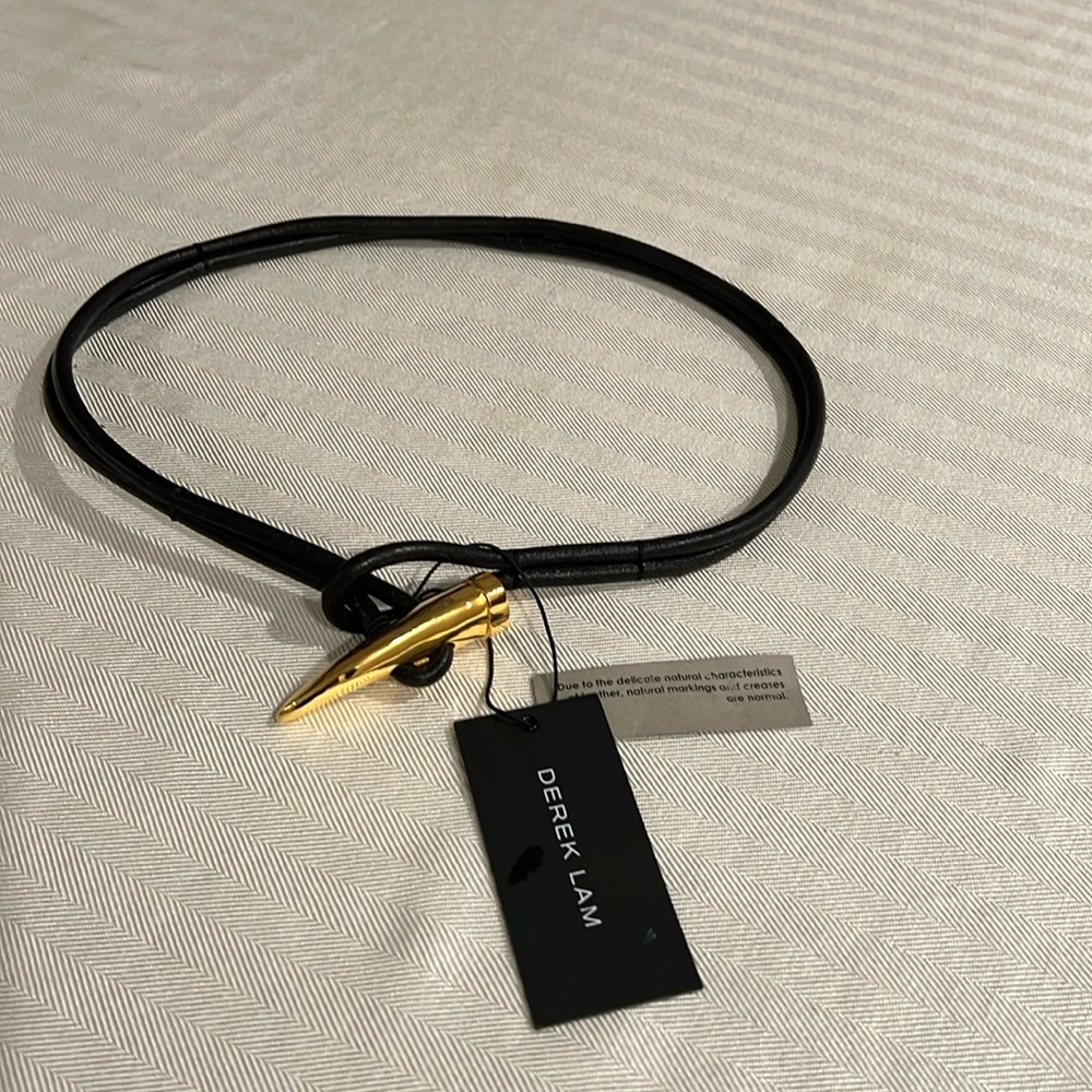 Derek Lam black leather belt with toggle closure.